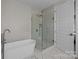 Main bathroom boasts a freestanding tub and glass-enclosed shower at 8018 Green Heron Ct, Belmont, NC 28012