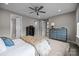 Airy main bedroom features a ceiling fan, neutral walls, and plenty of natural light at 8018 Green Heron Ct, Belmont, NC 28012