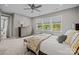 Bright main bedroom with a ceiling fan, large windows, and comfortable furnishings at 8018 Green Heron Ct, Belmont, NC 28012