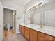 Bathroom features double vanity with wood cabinetry and a large mirror at 8274 Windsor Ridge Dr, Charlotte, NC 28277