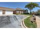 Home exterior features a two-car garage and lengthy driveway at 8274 Windsor Ridge Dr, Charlotte, NC 28277