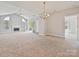 Spacious living room with vaulted ceiling, ceiling fan, and fireplace at 8274 Windsor Ridge Dr, Charlotte, NC 28277