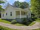 Well-maintained home with a welcoming front porch and manicured lawn, providing great curb appeal at 83 Tribune Sw Ave, Concord, NC 28025