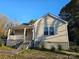 Charming single-Gathering home featuring a covered front porch and neutral siding, inviting and well-maintained at 83 Tribune Sw Ave, Concord, NC 28025
