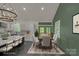 Open floorplan with a modern dining table and chairs next to a well-equipped kitchen at 856 Driftwood Rd, Lincolnton, NC 28092