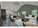 Stylish living room with a green accent wall, comfortable seating, and lots of natural light at 856 Driftwood Rd, Lincolnton, NC 28092
