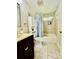 Bathroom featuring a vanity, toilet, and tiled shower with a patterned shower curtain at 9007 Mcmillian Dr, Harrisburg, NC 28075
