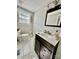 Chic bathroom with a modern vanity, marble floors, and stylish fixtures, offering a spa-like experience at 9007 Mcmillian Dr, Harrisburg, NC 28075