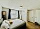 Comfortable bedroom featuring a plush bed, soft lighting, and a large window, ensuring relaxation and tranquility at 9007 Mcmillian Dr, Harrisburg, NC 28075