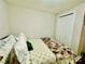 Bright bedroom with a comfy bed and neutral decor, featuring a closet for convenient storage at 9007 Mcmillian Dr, Harrisburg, NC 28075