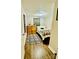 Cozy bedroom features wood-look flooring, dresser, and ample natural light through a window at 9007 Mcmillian Dr, Harrisburg, NC 28075