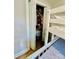 Bedroom closet featuring stored clothes and a bunk bed at 9007 Mcmillian Dr, Harrisburg, NC 28075