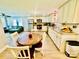 Spacious kitchen with stainless steel appliances, granite countertops, and a view into the adjacent living room at 9007 Mcmillian Dr, Harrisburg, NC 28075