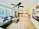 Open floor plan showcasing the living room and kitchen, featuring stainless steel appliances and a breakfast nook at 9007 Mcmillian Dr, Harrisburg, NC 28075