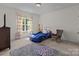 Fun ' bedroom with car-themed bed, playful decor, and soft carpet at 9494 Leyton Dr, Harrisburg, NC 28075