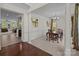 Formal dining room with wainscoting, chandelier, and view into the living room at 9494 Leyton Dr, Harrisburg, NC 28075