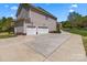 Spacious driveway leading to a three-car garage with ample parking at 9494 Leyton Dr, Harrisburg, NC 28075