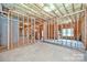 Unfinished basement shows stud framing, block walls, and is ready to be finished at 9810 Daufuskie Dr, Charlotte, NC 28278