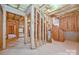 Unfinished basement shows stud framing, block walls, and is ready to be finished at 9810 Daufuskie Dr, Charlotte, NC 28278