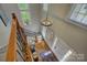 Entry foyer with stairs, hardwood floors, and a decorative chandelier at 9810 Daufuskie Dr, Charlotte, NC 28278