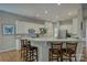 Spacious kitchen featuring a breakfast bar, stainless steel appliances, and modern lighting at 9810 Daufuskie Dr, Charlotte, NC 28278