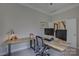 Home office offering a standup desk with dual monitors at 9810 Daufuskie Dr, Charlotte, NC 28278