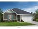 Charming one-story home with gray siding, stone accents, well-manicured lawn and a two car garage at Lot#82 Norwood Ct, Denver, NC 28037