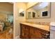 Bathroom featuring double sinks, vanity, and large mirror at 10316 Whitethorn Dr, Charlotte, NC 28277