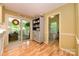 Cozy breakfast nook with sliding doors to screened porch and hardwood floors at 10316 Whitethorn Dr, Charlotte, NC 28277