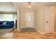 Bright foyer featuring wood floors and a decorative front door with glass at 10316 Whitethorn Dr, Charlotte, NC 28277