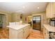 Spacious kitchen with island, stainless steel refrigerator, and easy access to the dining area at 10316 Whitethorn Dr, Charlotte, NC 28277