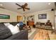 Living room featuring a bar with dark wood cabinetry and various storage spaces at 10316 Whitethorn Dr, Charlotte, NC 28277