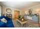 Comfortable living room with wood floors, blue sofa and stylish accents at 10316 Whitethorn Dr, Charlotte, NC 28277