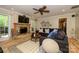 Cozy living room offers a stone fireplace, comfortable seating, and bright natural light at 10316 Whitethorn Dr, Charlotte, NC 28277