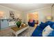 Cozy living room featuring a blue sofa and stylish décor at 10316 Whitethorn Dr, Charlotte, NC 28277