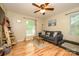 Comfortable living room with hardwood floors and a window offering natural light at 10316 Whitethorn Dr, Charlotte, NC 28277