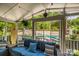 Inviting sunroom with comfortable seating and view of the pool area at 10316 Whitethorn Dr, Charlotte, NC 28277