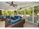 Cozy sunroom with wicker furniture, string lights, and a view of the backyard pool at 10316 Whitethorn Dr, Charlotte, NC 28277