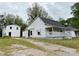 Renovation property featuring a classic facade with an additional building in the back at 104 E Church St, Dallas, NC 28034