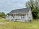 Traditional home featuring a cozy porch and classic architecture, ideal for renovation at 104 E Church St, Dallas, NC 28034