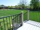 View from deck showing the large backyard with split rail fence at 107 Garden Ter, Dallas, NC 28034