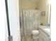 Clean bathroom with a granite countertop, shower, and neutral-colored decor at 107 Garden Ter, Dallas, NC 28034