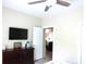 Cozy bedroom with a ceiling fan, mounted TV, and stylish decor at 107 Garden Ter, Dallas, NC 28034