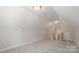 Carpeted bonus room with natural light and neutral color palette at 107 Garden Ter, Dallas, NC 28034