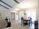 Bright dining space featuring wood flooring and view to the kitchen area at 107 Garden Ter, Dallas, NC 28034