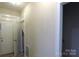 Neutral hallway with white trim doors entering the living space and a second level stairway at 107 Garden Ter, Dallas, NC 28034