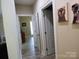 Bright hallway featuring hardwood floors, white trim, and decorative wall art at 107 Garden Ter, Dallas, NC 28034