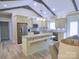 Modern kitchen with stainless steel appliances, granite countertops, and a large island, perfect for entertaining at 107 Garden Ter, Dallas, NC 28034