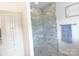 Modern shower featuring glass doors and light tile work and coordinated fixtures at 107 Garden Ter, Dallas, NC 28034