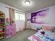Bedroom with neutral carpet, a window, wall decor, and decorative curtains at 110 Dutch Creek Rd, Rockwell, NC 28138